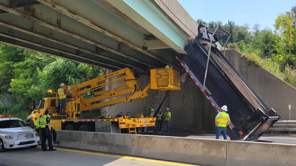 Dump truck strikes overpass on Route 40 in California - Herald-Standard